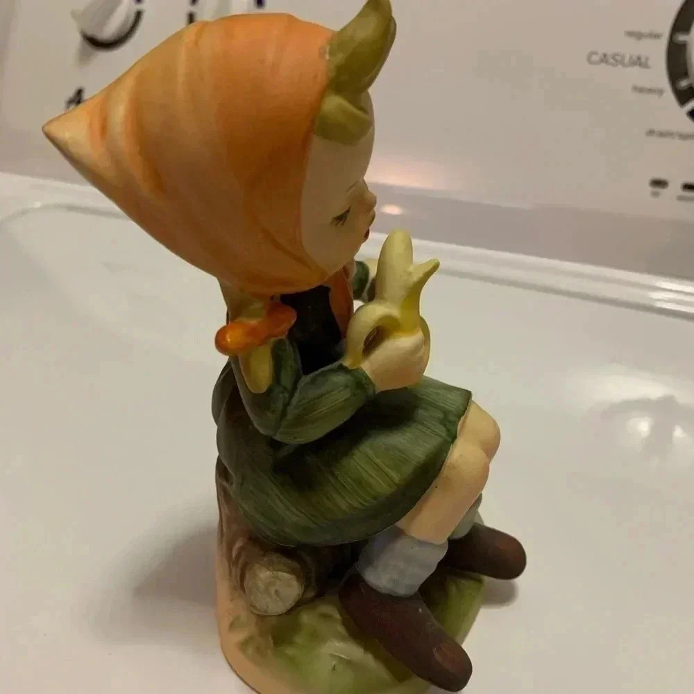 Girl Designed Figure Eatting a Banana on a Tree Stump - Picture 4 of 5